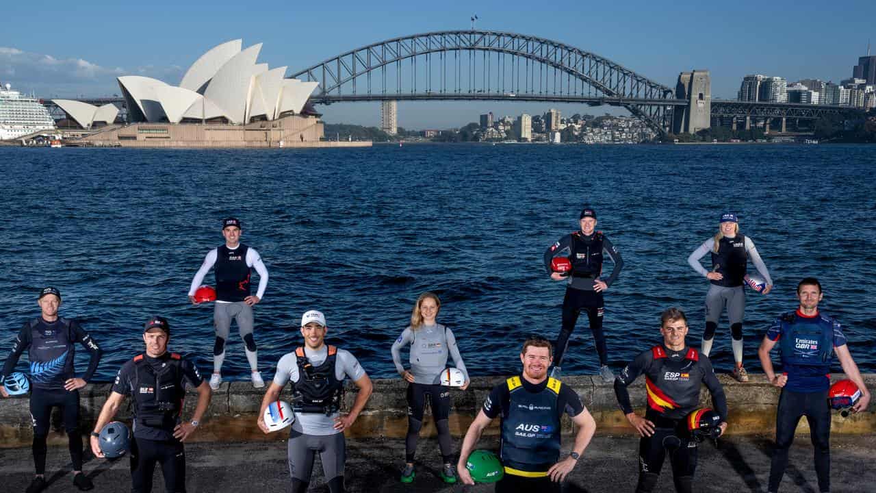 All 10 SailGP drivers pose by Sydney Harbour.