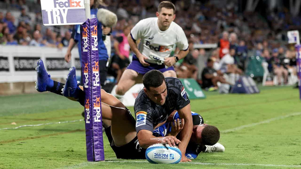 Josh Moorsby scores a try for the Hurricanes.