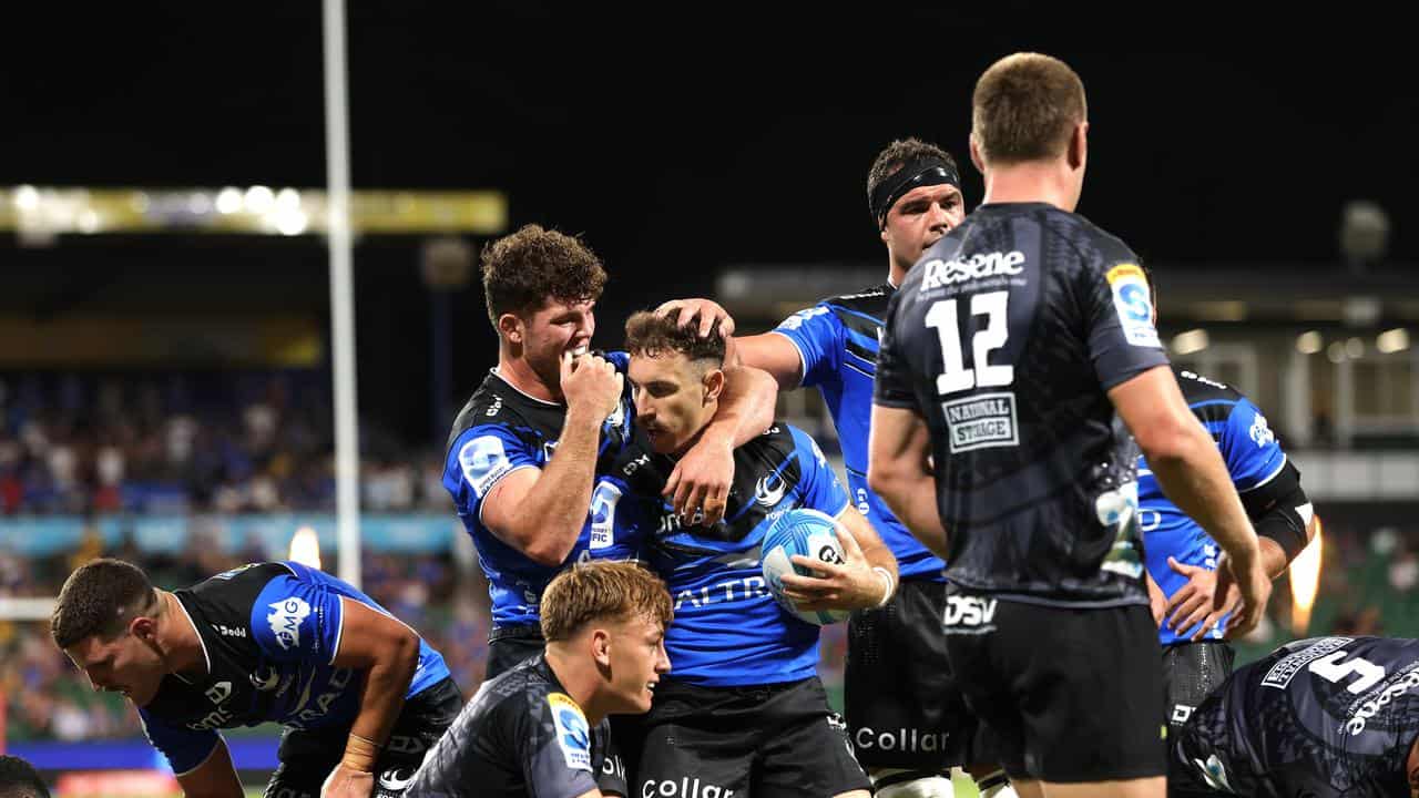 Nic White is congratulated after scoring for Western Force.