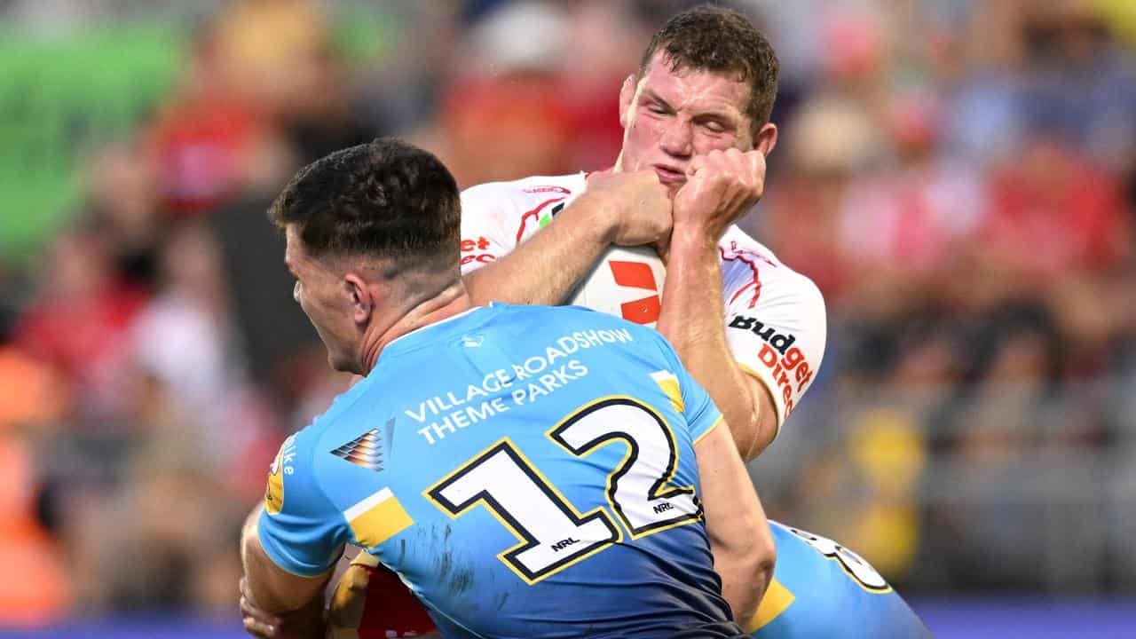 Tom Gilbert is tackled by Beau Fermor.