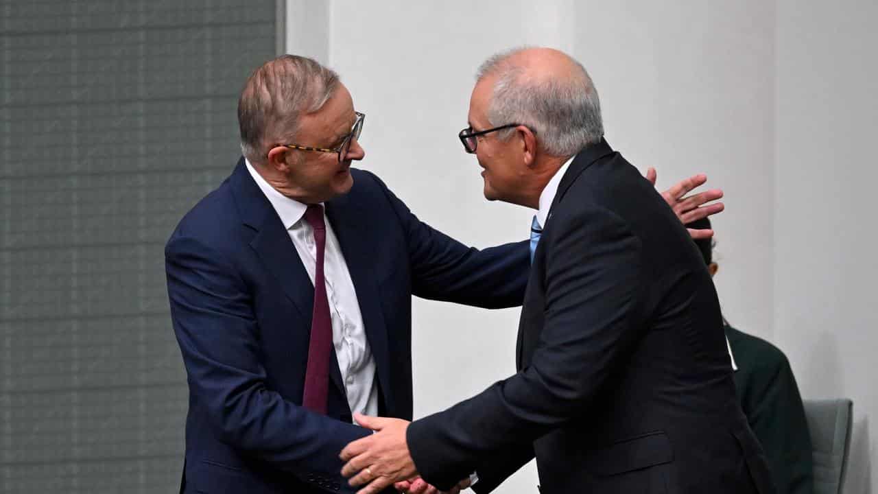 Anthony Albanese shakes hands with Scott Morrison.