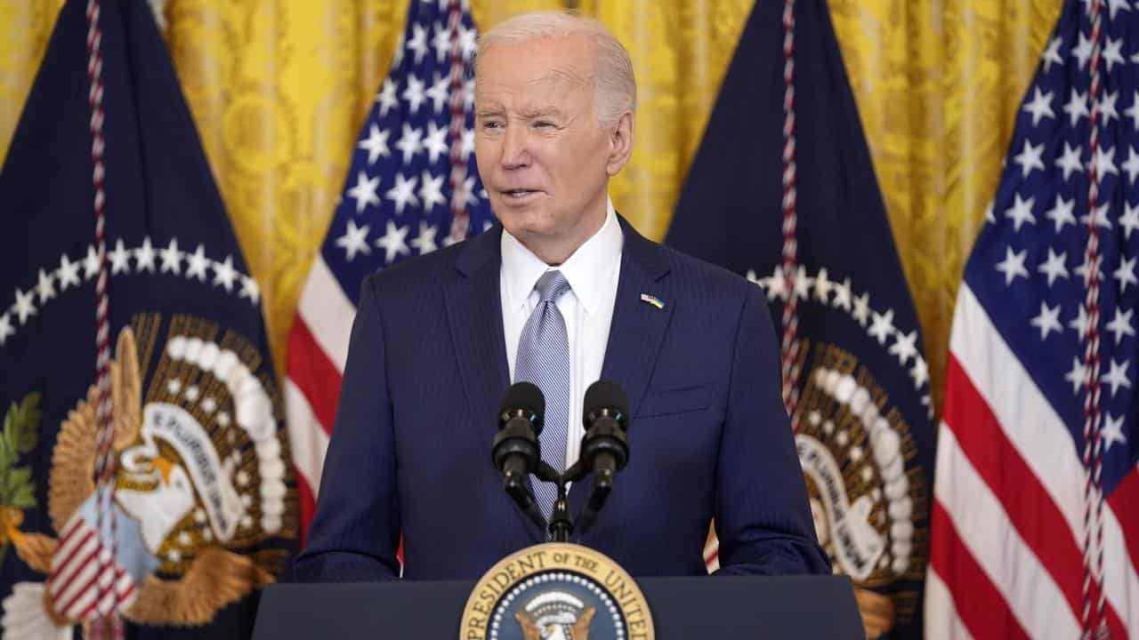 US President Joe Biden speaks in the East Room of the White House