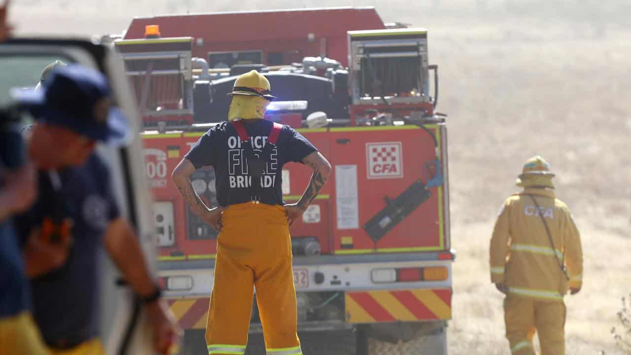 A CFA crew enters a paddock outside Beaufort, Victoria.