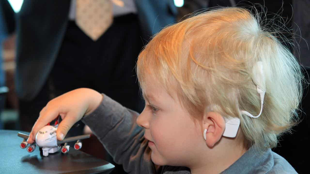 A boy with a Cochlear implant