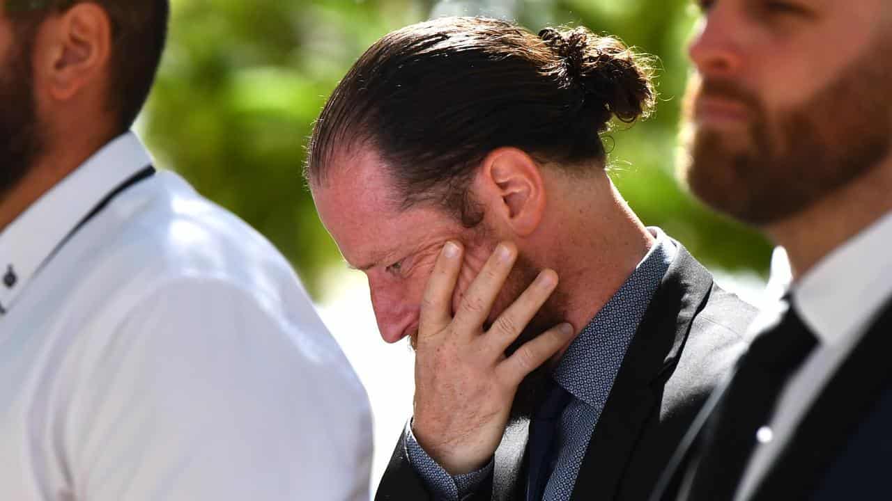 Simon Cross arrives at the Brisbane District Court