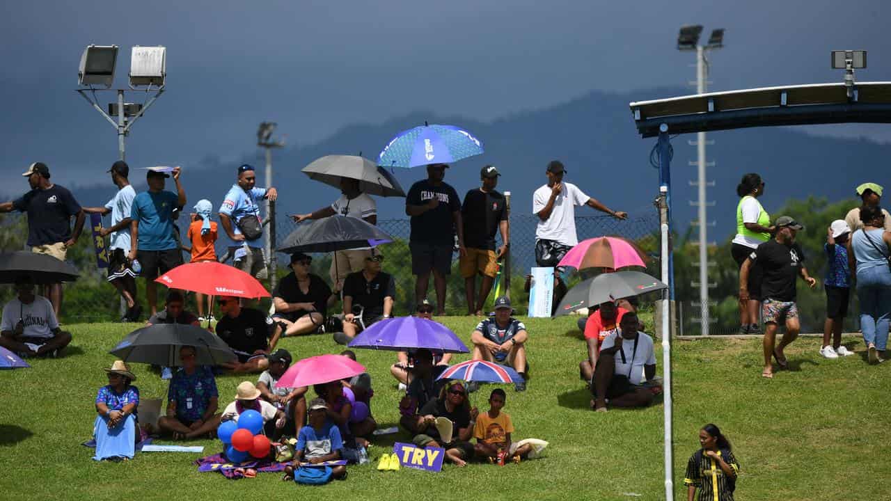 NRL fans in Fiji watching trial game.