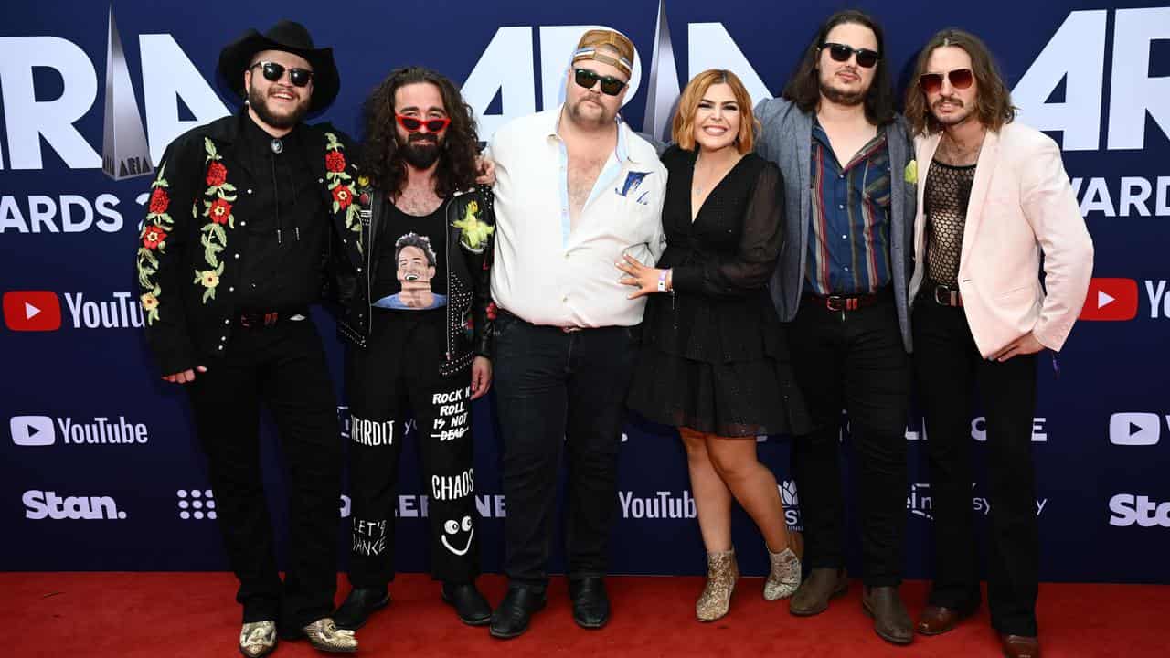 Artist Brad Cox (3rd left) and his band.