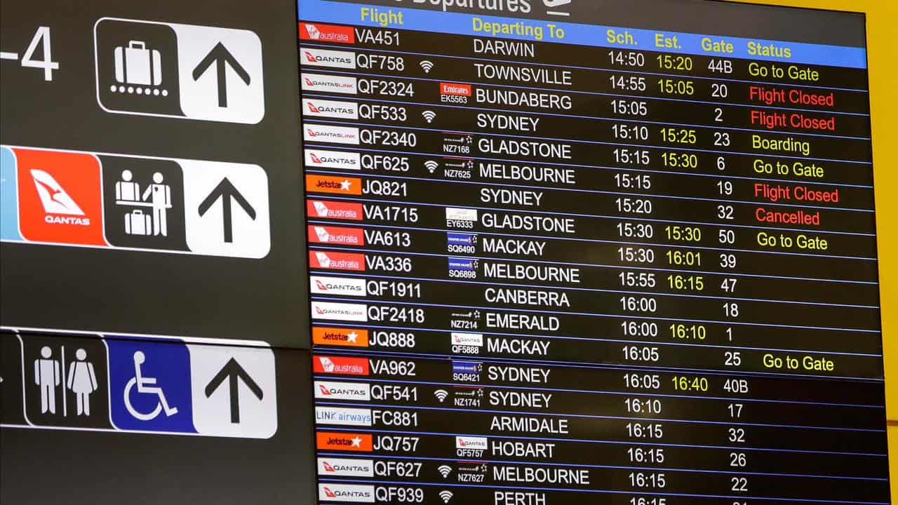 Flight lists are seen at Brisbane Domestic Airport