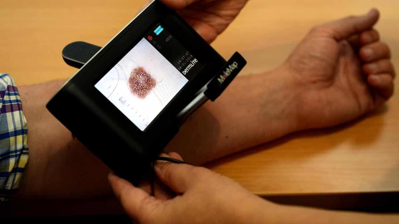 A patient being checked for skin cancers (file image)