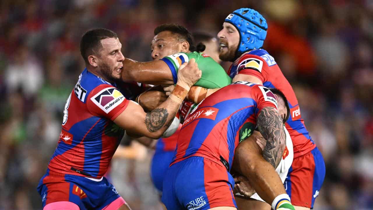 Action from Newcastle Knights against Canberra Raiders.