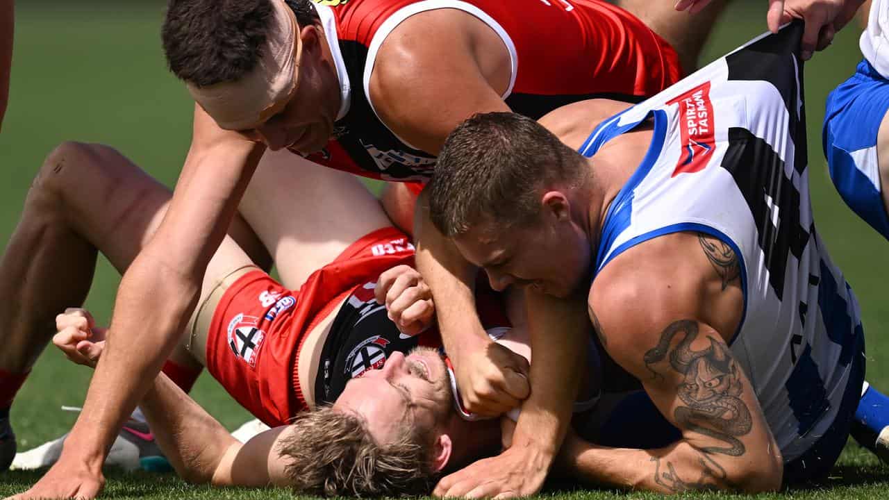 Players scuffle during St Kilda against North Melbourne. 