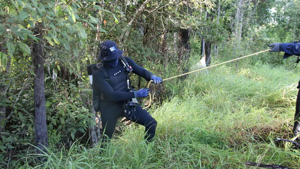 Police search at a 44-hectare property in Booyal in rural Queensland