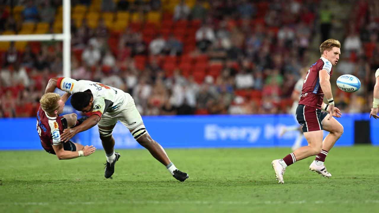 Tom Lynaghis tackled by the Chiefs' Samipeni Finau.