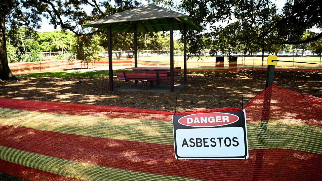 An asbestos sign at a park