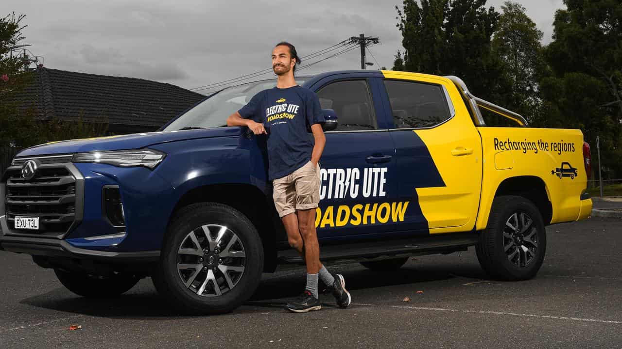 Ajaya Haikerwal from Solar Citizens poses with his electric ute