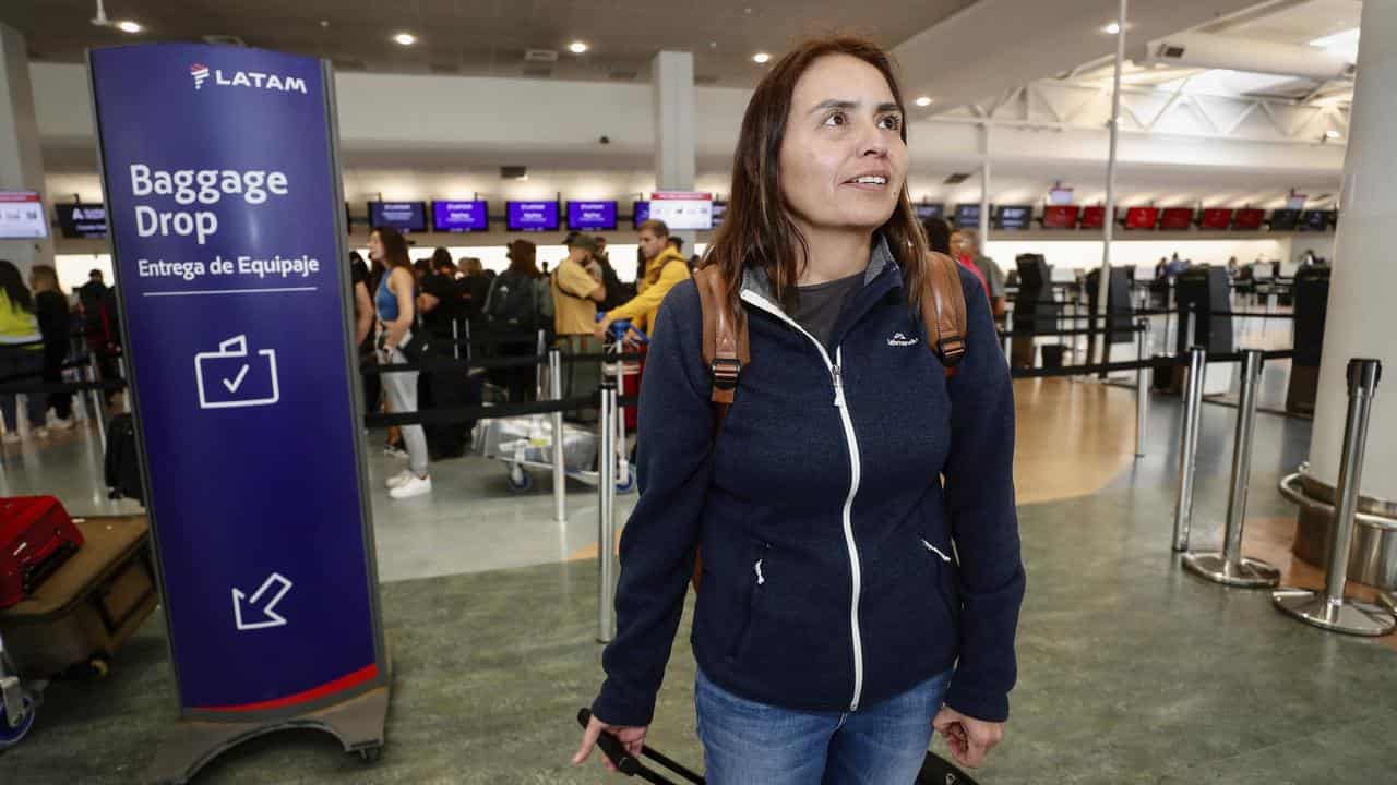 Passenger Janet Baker checking in for the LATAM flight to Chile