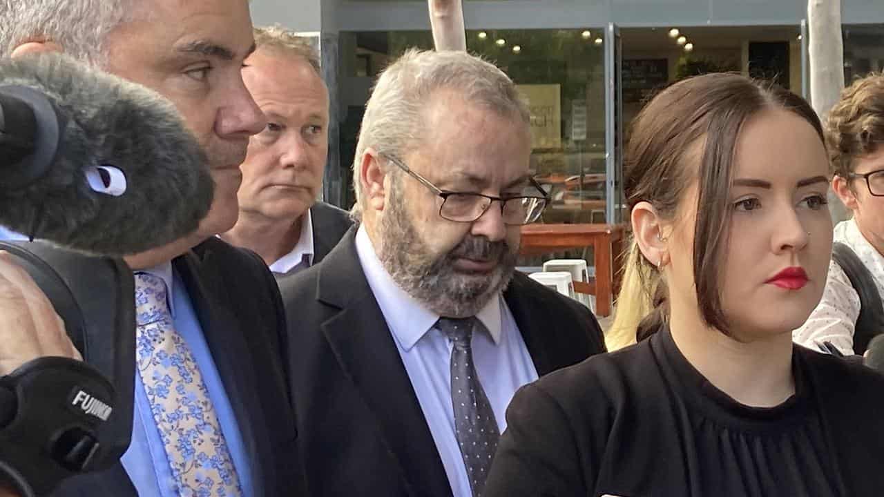 Bus driver Brett Button (centre) outside Newcastle Court House