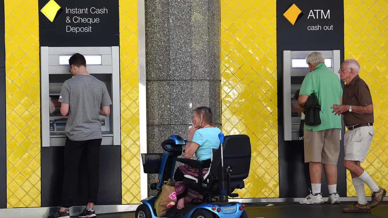 People using ATMs (file image)