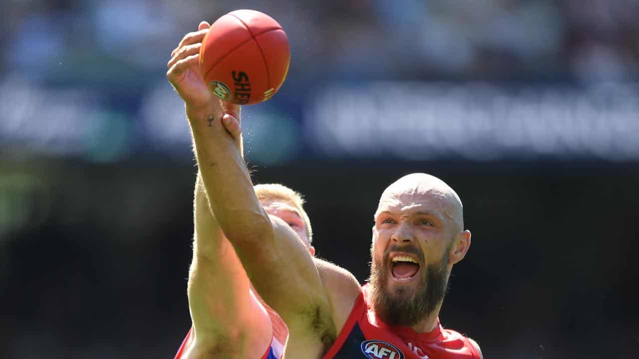 Max Gawn and Tim English contest a ruck duel.