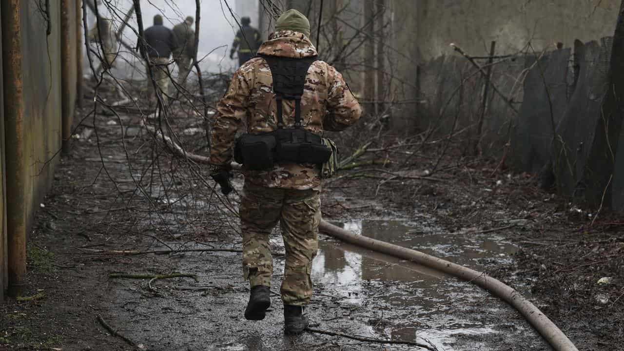 Ukrainian soldiers at scene of a Russian attack in Odesa