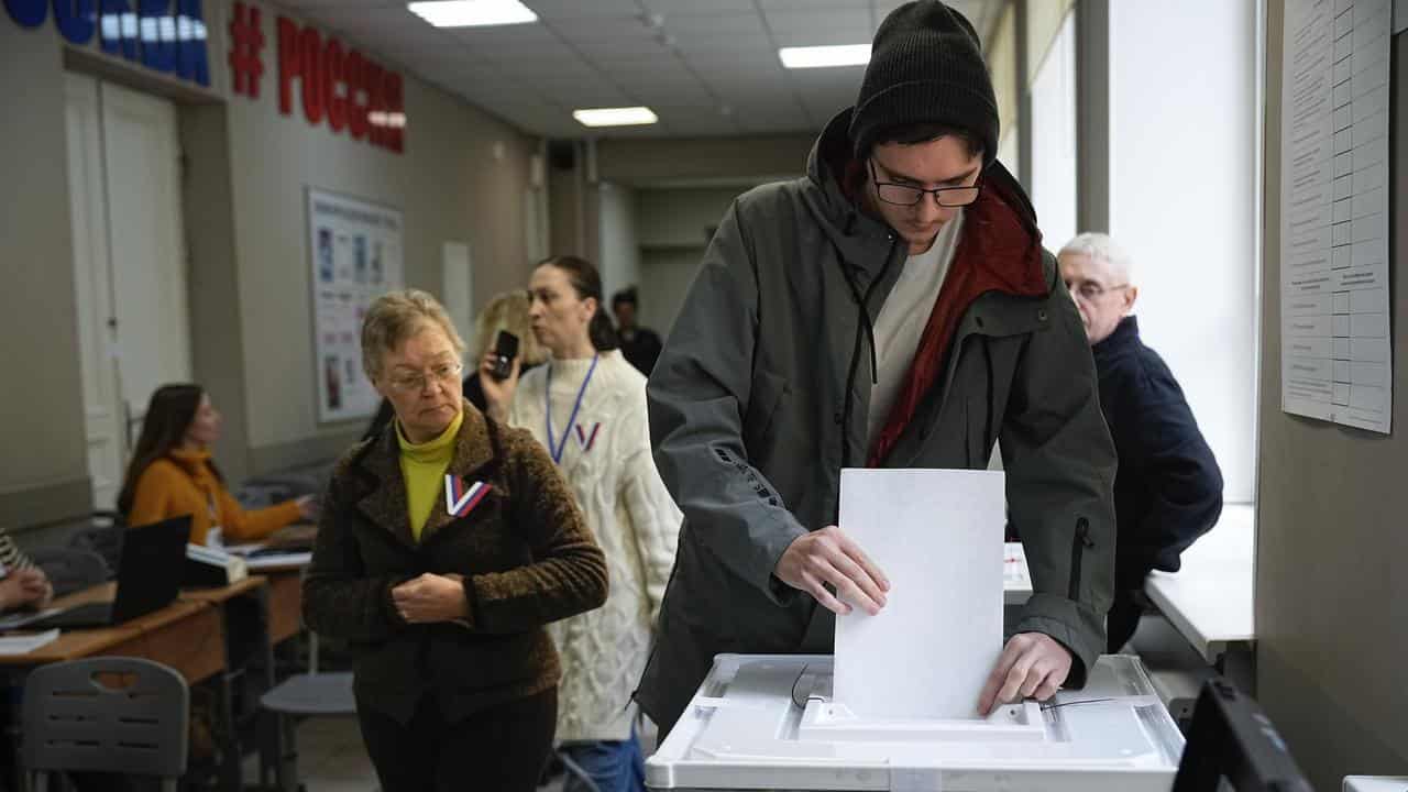 A man casts his ballot during a presidential election in Moscow