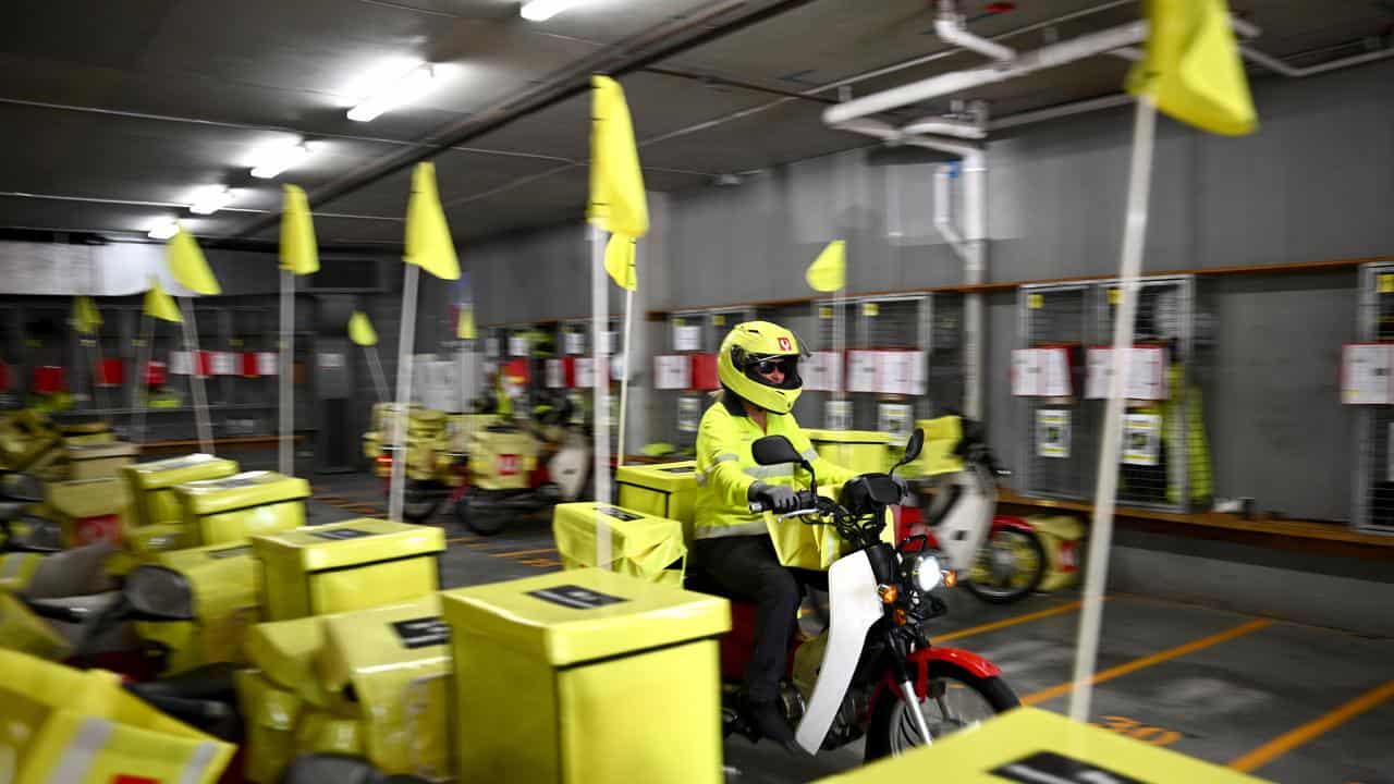 Australia Post delivery workers preparing to deliver mail