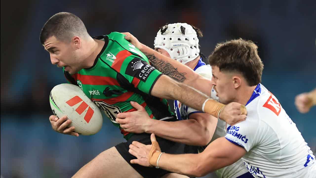 South Sydney's Dean Hawkins (left).