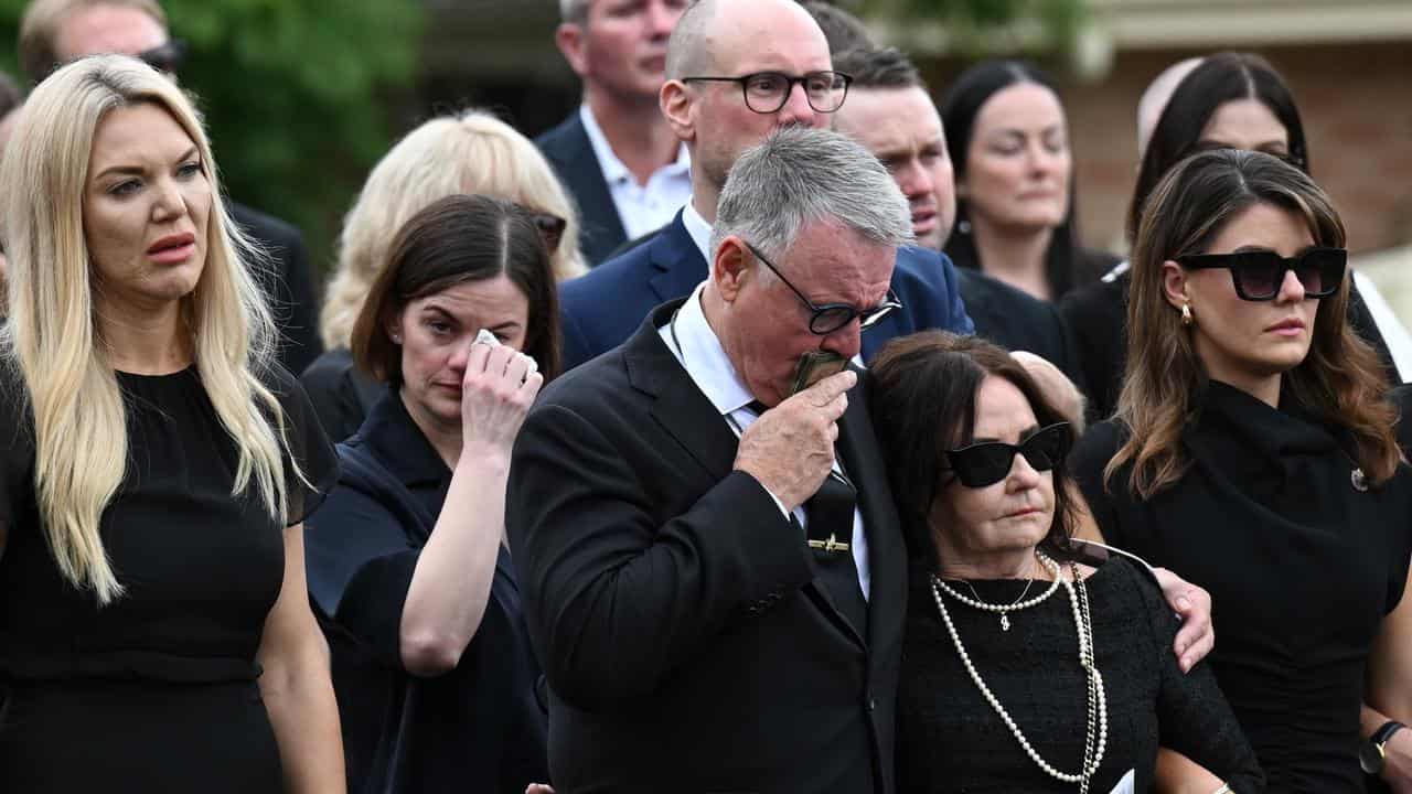 Joel Fitzgibbon with family and friends at his son’s funeral