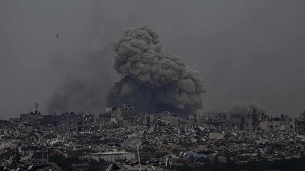 Smoke and explosions rise inside the Gaza Strip