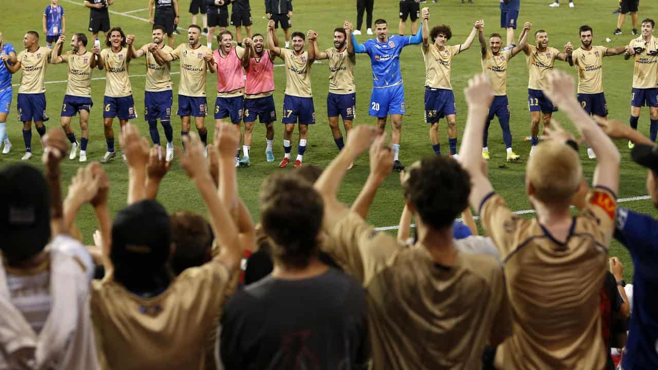 Newcastle Jets players and fans.