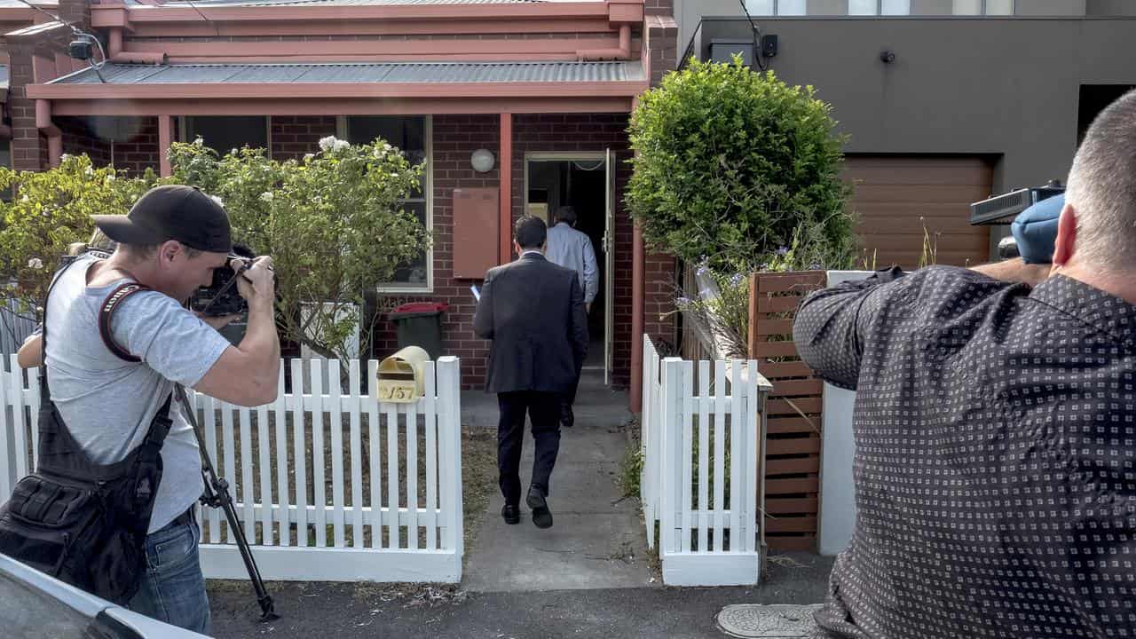 Detectives at the Kensington house (file image)