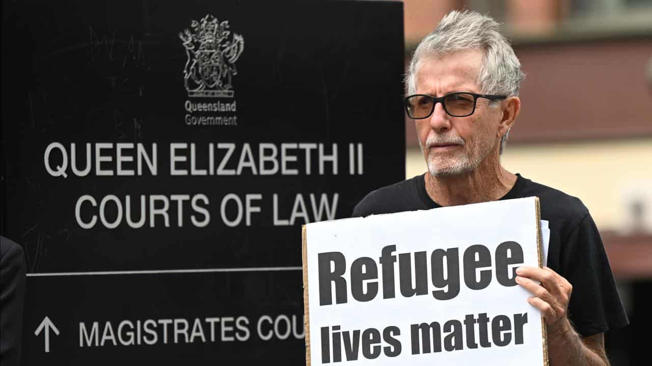 An activist outside the court complex (file image)