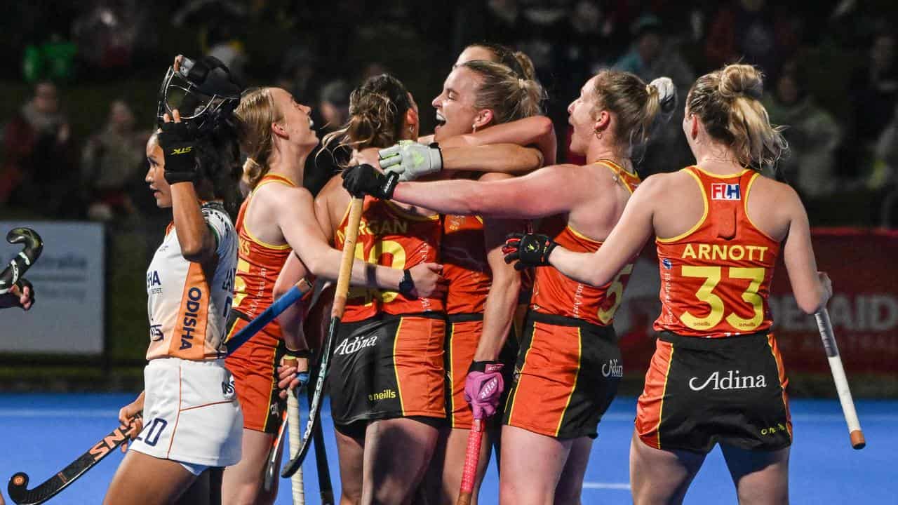 Hockeyroos players celebrate.