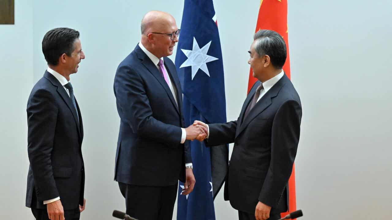 Peter Dutton meets Wang Yi.