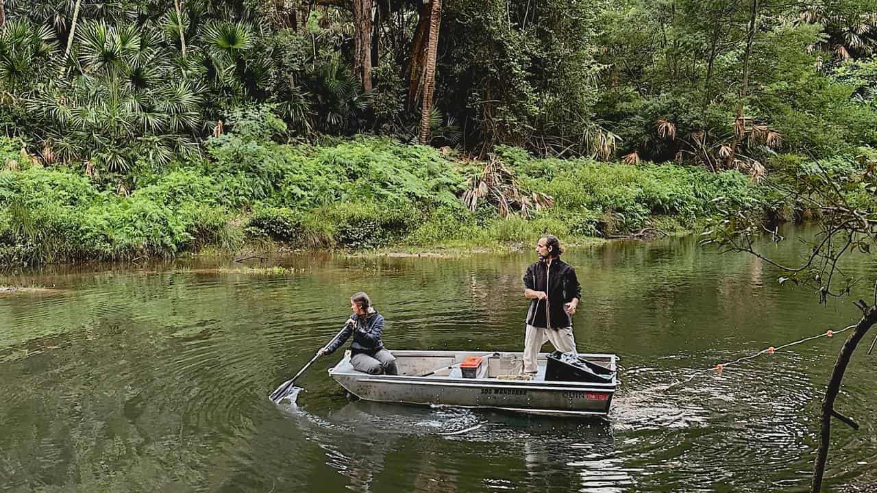 Researchers in a boat.