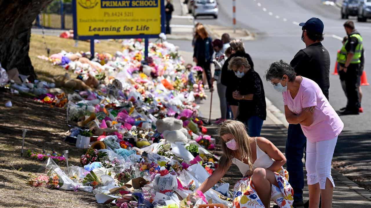 Members of the public pay respects outside Hillcrest Primary School