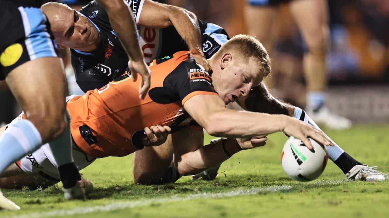 Alex Seyfarth touches down for the Tigers in their 32-6 win v Cronulla