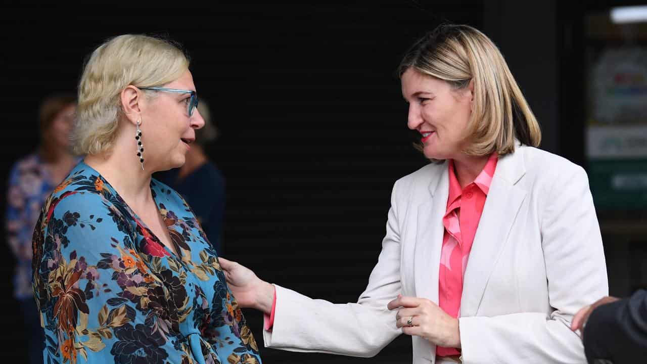 Queensland Health Minister Shannon Fentiman (R) and Holly Robbins