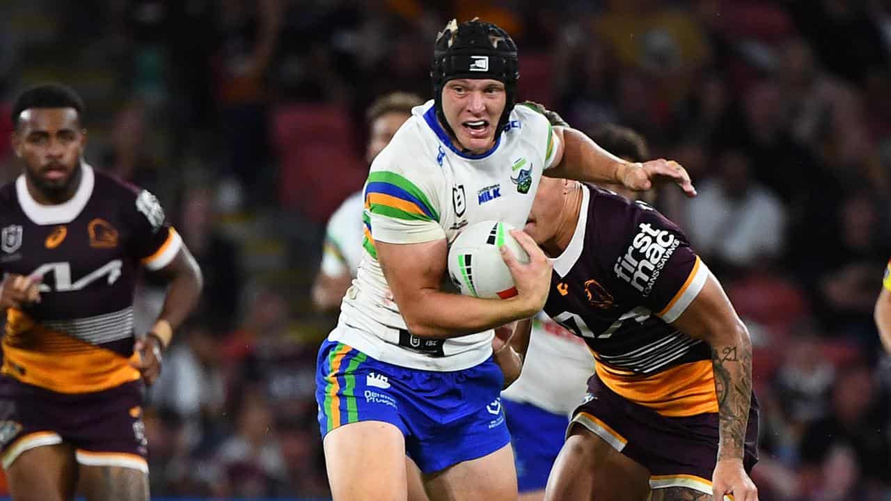 Brad Schneider runs with the ball for Canberra. 