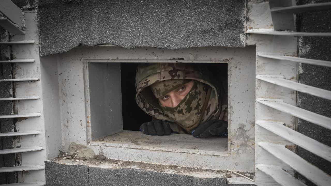 A worker inspects a new pillbox in the Kharkiv region