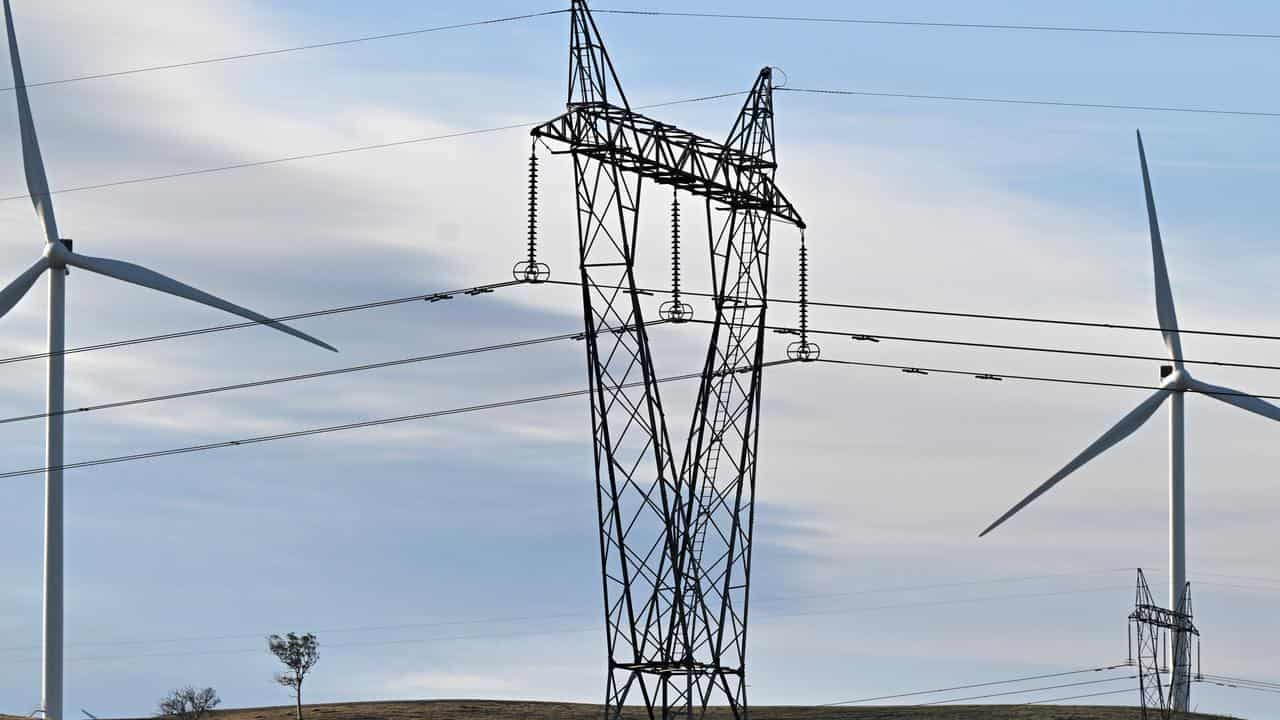 Power-generating windmill turbines and electricity pylons