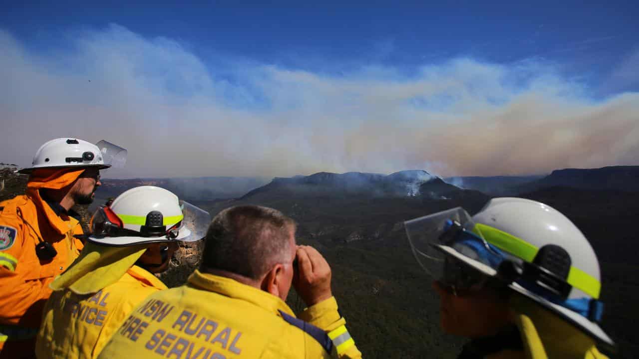 NSW Rural Fire Service personnel assess a bushfire in Katoomba