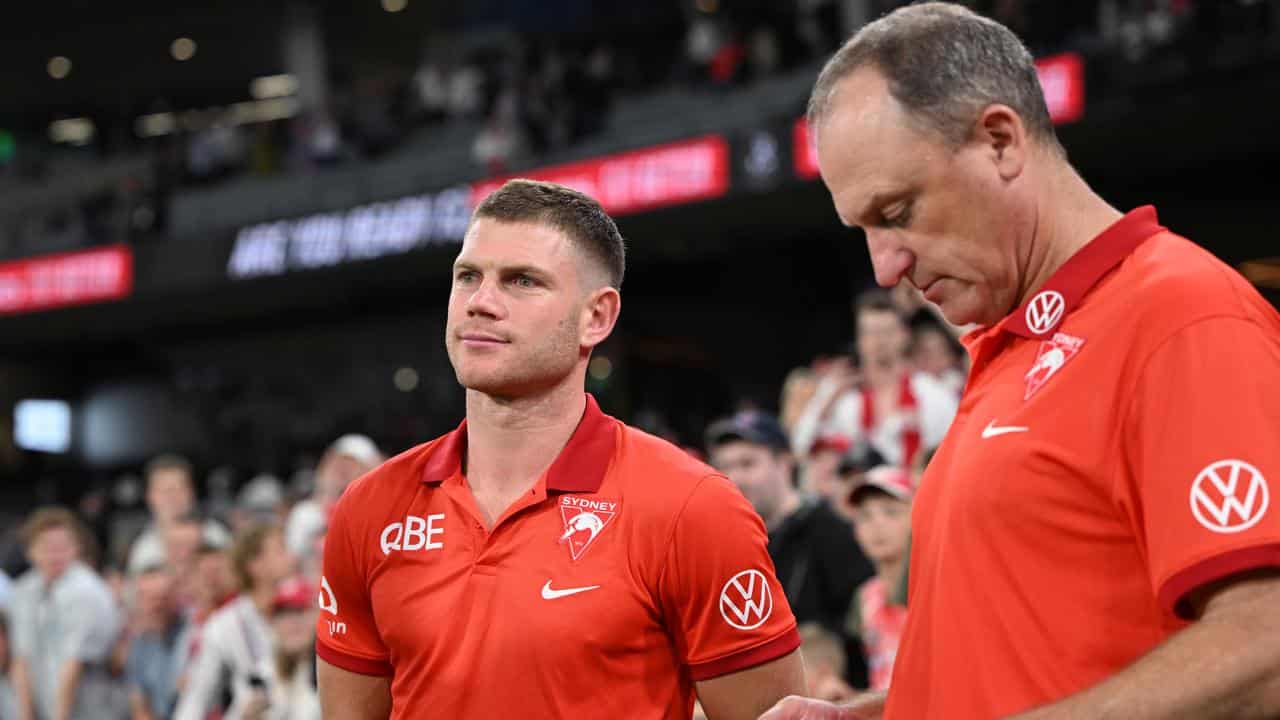 Sydney recruit Taylor Adams (left) and coach John Longmire