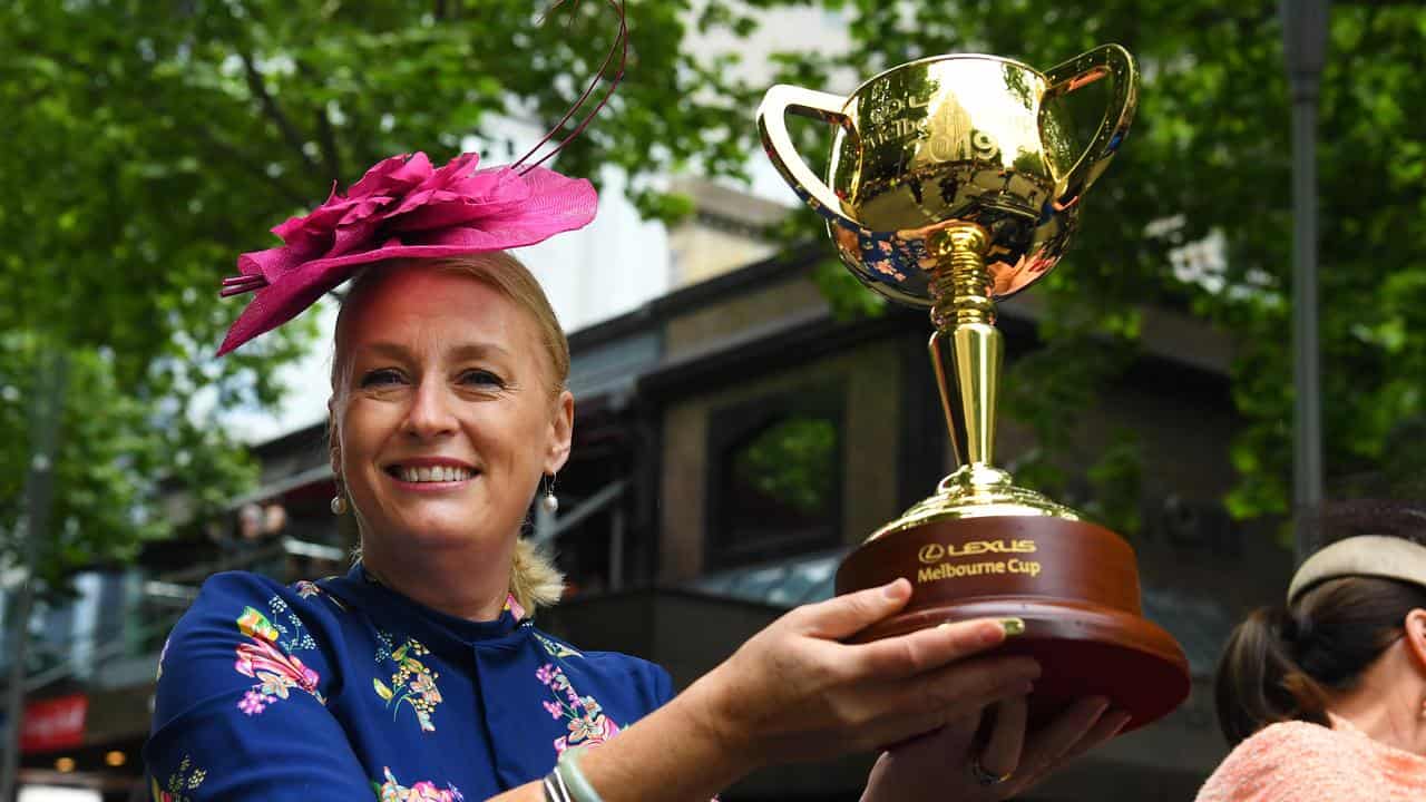 Lord Mayor Sally Capp holds the Melbourne Cup