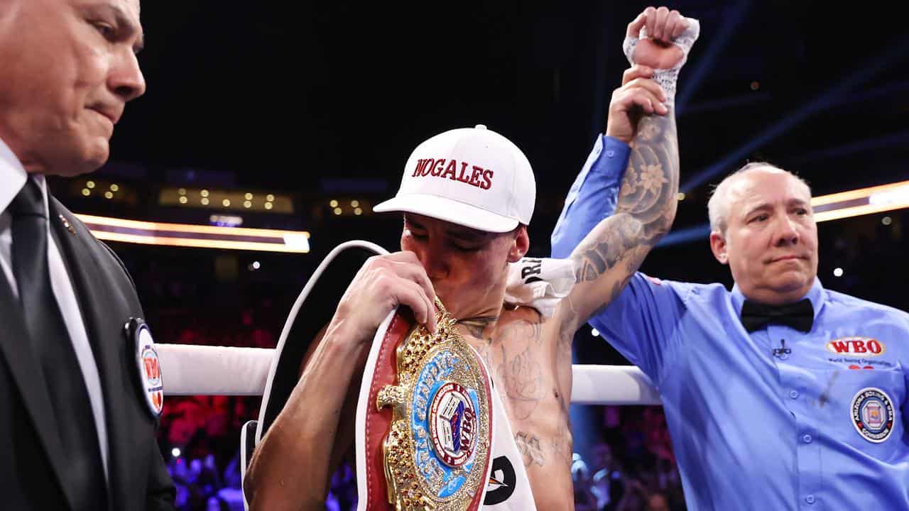 Oscar Valdez kisses the WBO super-featherweight belt. 