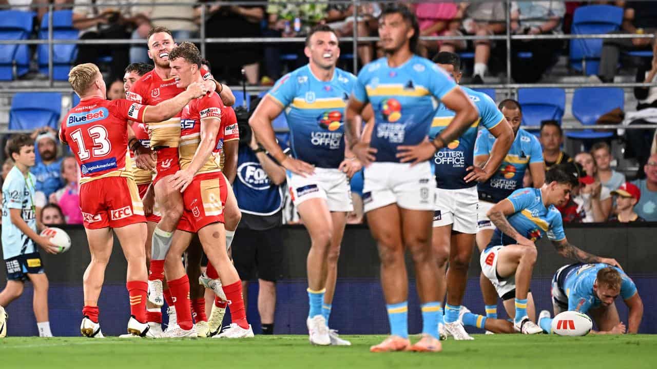 Dolphins players celebrate after Jack Bostock scored a  try