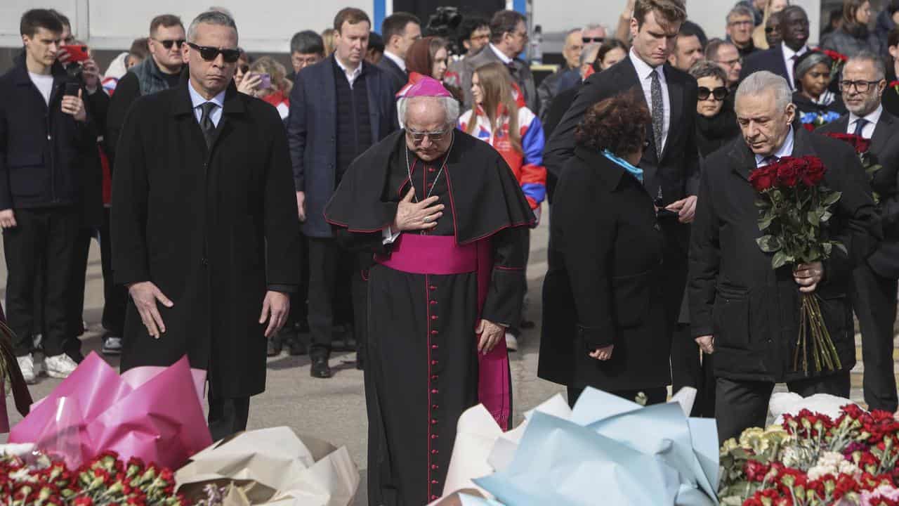 Envoys at a laying ceremony at Crocus City Hall