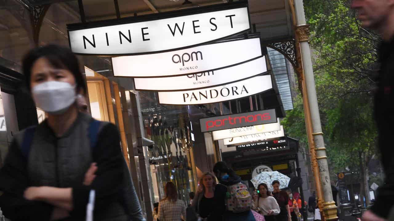 People are seen in the Central Business district in Sydney,