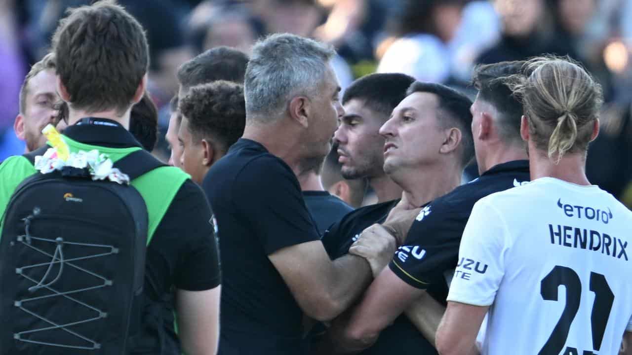 Mark Rudan remonstrates with a member of Macarthur's coaching staff.