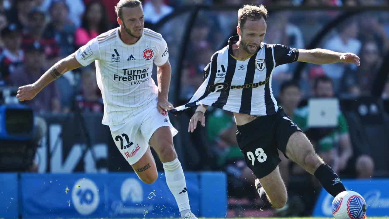 Jorrit Hendrix tussles with Valere Germain of Macarthur.